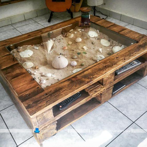 ساختن مبل در خانه با پالت های چوبی دور ریختنی. میز وسط مبلی چوبی و شیشه ای در مدل های ارزان قیمت که می توان در خانه ساخت.